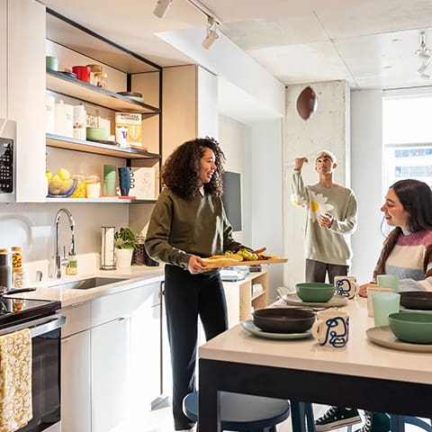 residents hanging out in a kitchen
